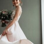 Dress - Woman Standing And Holding Bouquet