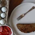 Healthy Eating - A plate of eggs, vegetables and a knife and fork