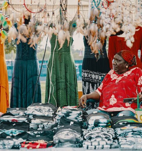 Dresses - Woman Seated Next to Assorted Dresses