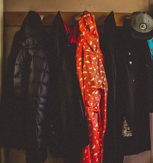 Coats - Hanged Black and Orange Coats Inside Room