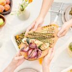 Meals - Hands Passing a Platter of Veggies