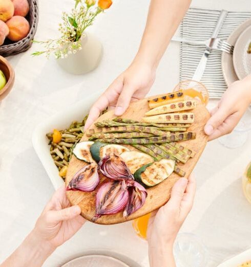 Meals - Hands Passing a Platter of Veggies