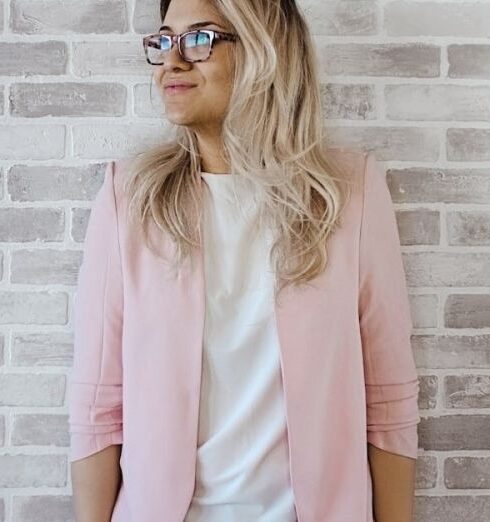 Cardigan - Woman in Pink Cardigan and White Shirt Leaning on the Wall