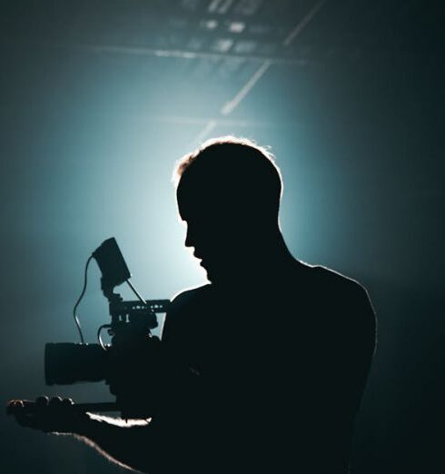 Set - Silhouette of Man Standing in Front of Microphone