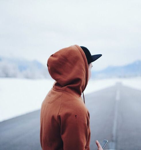 Hoodies - Man Wearing Brown Hoodie in Road