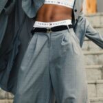 Pants - Woman in Gray Blazer Stands on Gray Concrete Floor