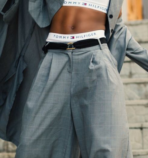 Pants - Woman in Gray Blazer Stands on Gray Concrete Floor