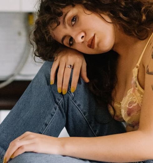 Bras - Woman Wearing a Bra Sitting on a Kitchen Counter