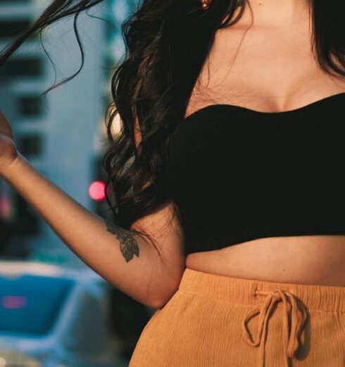 Tops - Woman Wearing Black Crop Top and Orange Skirt Standing