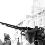 Tanks - Grayscale Photo of Man Holding Rifle