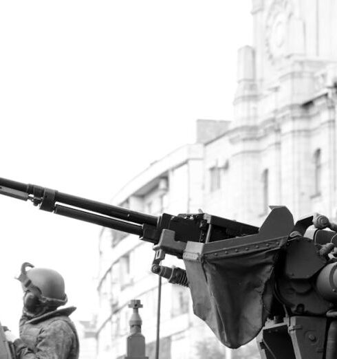 Tanks - Grayscale Photo of Man Holding Rifle