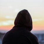 Hoodies - Man Sitting on Bench