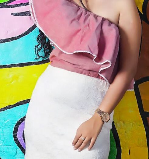 Skirt - Woman Wearing Pink Off Shoulder Blouse and White Skirt Leaning on Graffiti Wall