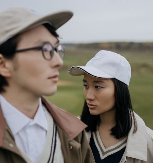 Jackets - Woman in Brown Coat Wearing White Cap and Sunglasses