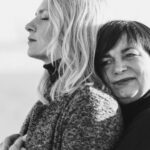 Turtleneck - Grayscale Photo of Woman Hugging Woman