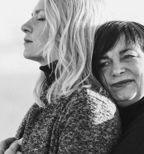 Turtleneck - Grayscale Photo of Woman Hugging Woman