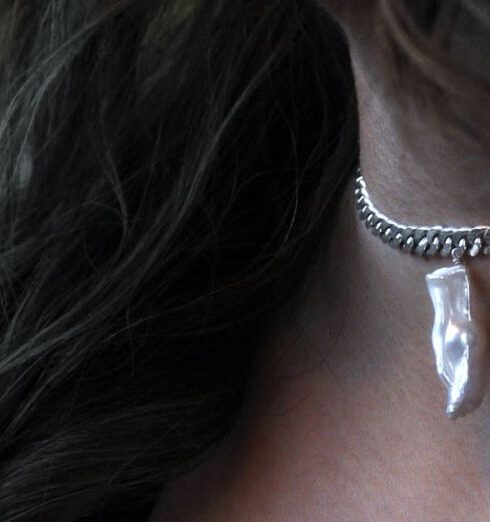 Jewelry - A Woman Wearing Silver Necklace