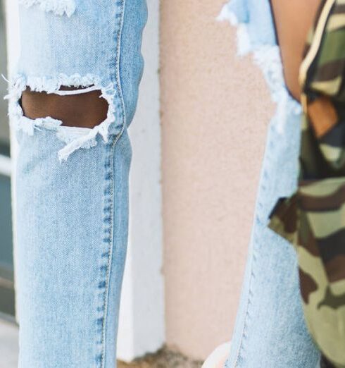 Jeans - Woman Leaning on Wall Carry Camouflage Backpack