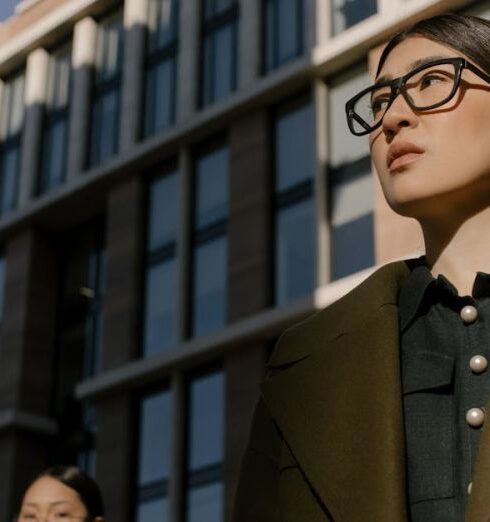 Coats - Woman in Brown Coat Standing Near Building