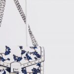 Handbags - White and Blue Floral Flap Sling Bag Hanging on White Steel Rack