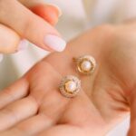 Earrings - Close-Up Photo of Person Holding Earrings