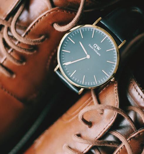 Belts - Close Up Photo of a Pair of Brown Shoes,Wrist Watch, Sunglasses,Belt and CK Spray