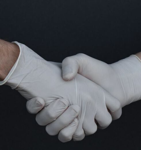 Gloves - People Shaking Hands in Latex Gloves