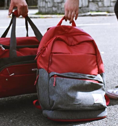 Bags - Two Person Carrying Duffel and Backpack