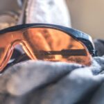 Gloves - Closeup Photo of Black Framed Brown Sunglasses