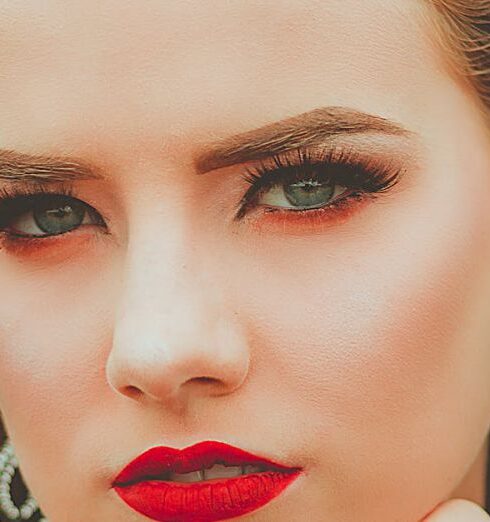 Earrings - Photo of Woman Wearing Silver-colored Earrings