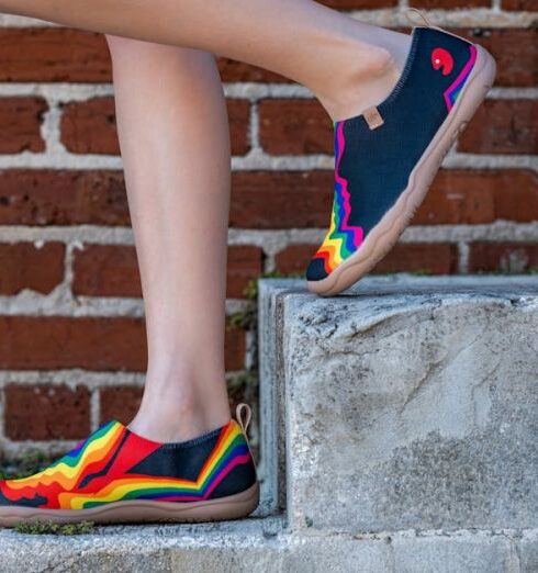 Espadrilles - A woman in colorful shoes standing on some steps