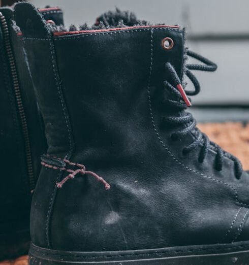 Boots - Pair of Black Lace-up Boots on Area Rug