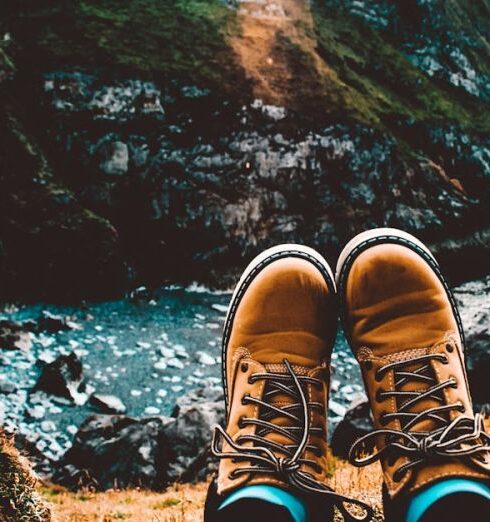 Boots - Person Wearing Pair of Brown Suede Work Boots Facing Body of Water