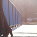 Boots - Woman Standing on Bridge