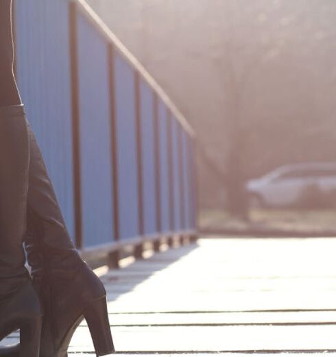 Boots - Woman Standing on Bridge