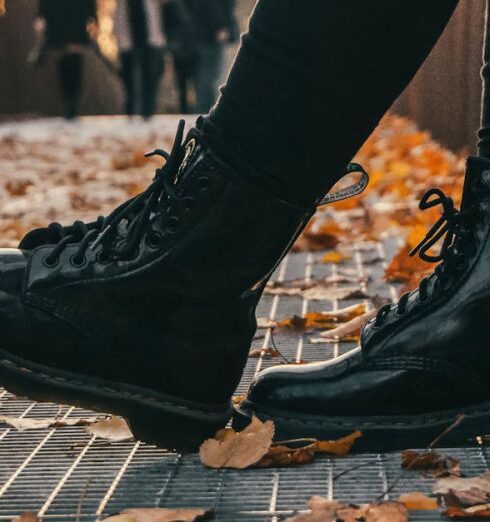 Boots - Low Angle Photo of Person Wearing Black Boots and Black Pants