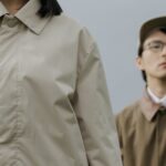 Jackets - Woman in Brown Coat Standing Beside Man in Brown Coat