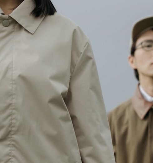 Jackets - Woman in Brown Coat Standing Beside Man in Brown Coat