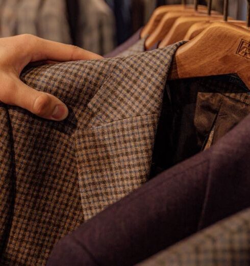 Jackets - Person Holding Brown and Black Checkered Textile