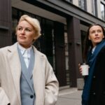 Outerwear - Woman in Beige Coat Standing Near Building