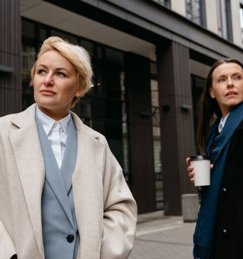 Outerwear - Woman in Beige Coat Standing Near Building