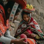 Capes - Peruvian Girls Wearing Traditional Clothing, Sitting by a Wall