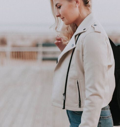 Jacket - Woman in Black Zip-up Jacket With Black Backpack