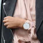 Jacket - Woman Wearing Peach Dress and Black Jacket's Left Hand Closeup Photography