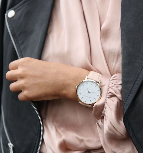 Jacket - Woman Wearing Peach Dress and Black Jacket's Left Hand Closeup Photography