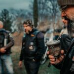 Jackets - A group of men in leather jackets and hats are drinking coffee