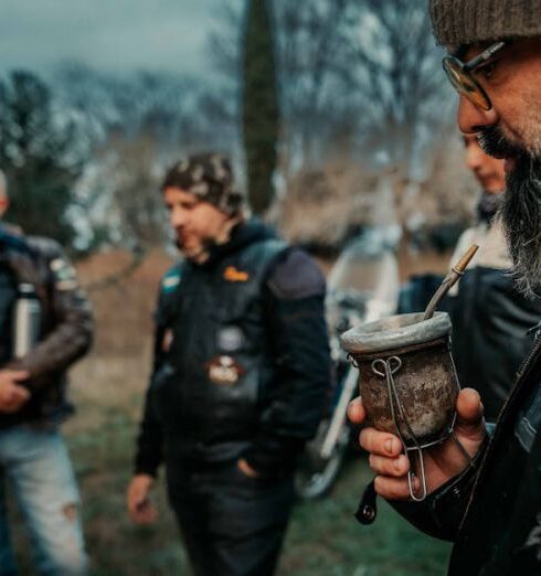 Jackets - A group of men in leather jackets and hats are drinking coffee