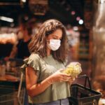 Healthy Eating - Woman wearing a face mask in a grocery store