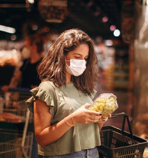 Healthy Eating - Woman wearing a face mask in a grocery store