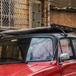 Jackets - A red car parked on the side of a street